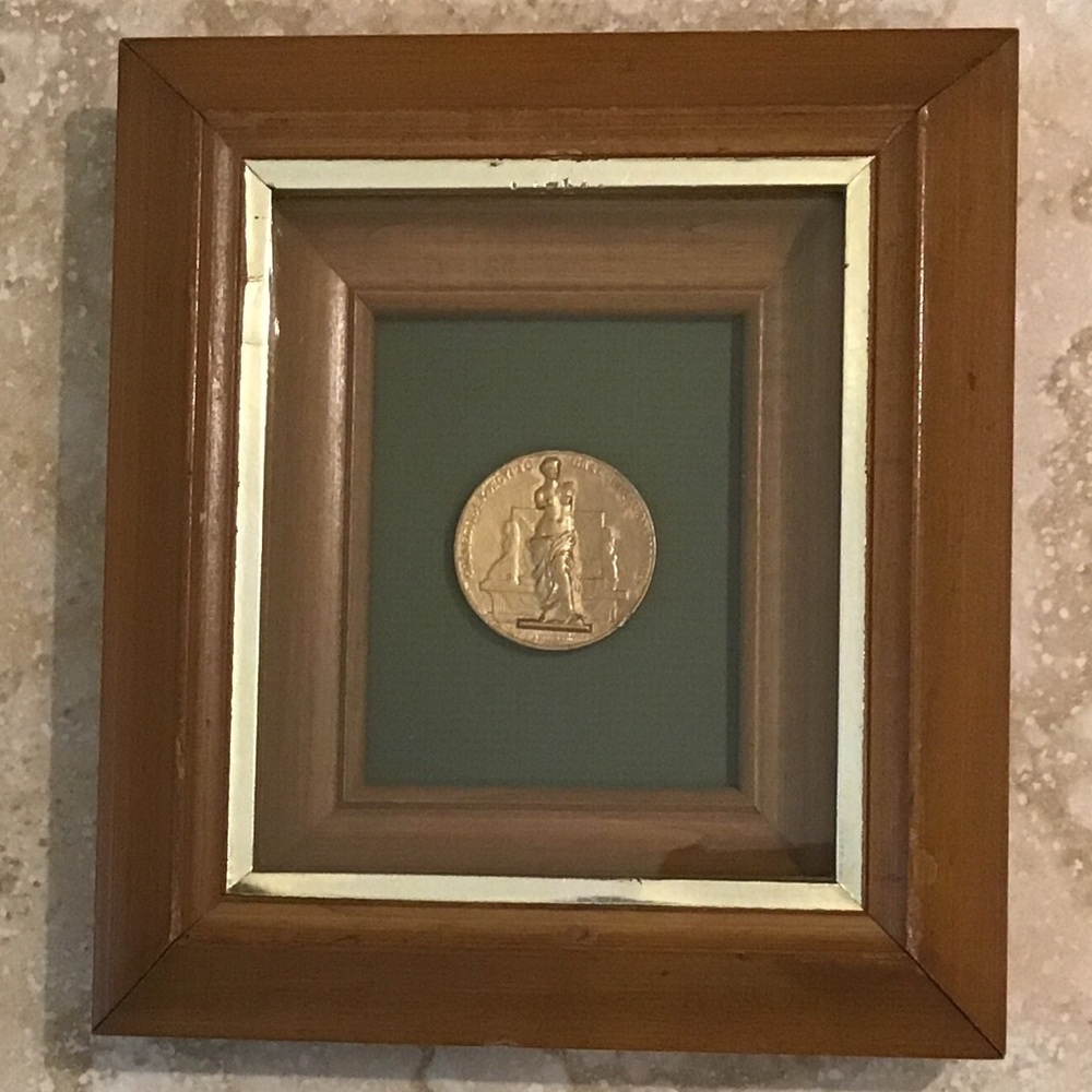Vintage shadow box framed replica coin.